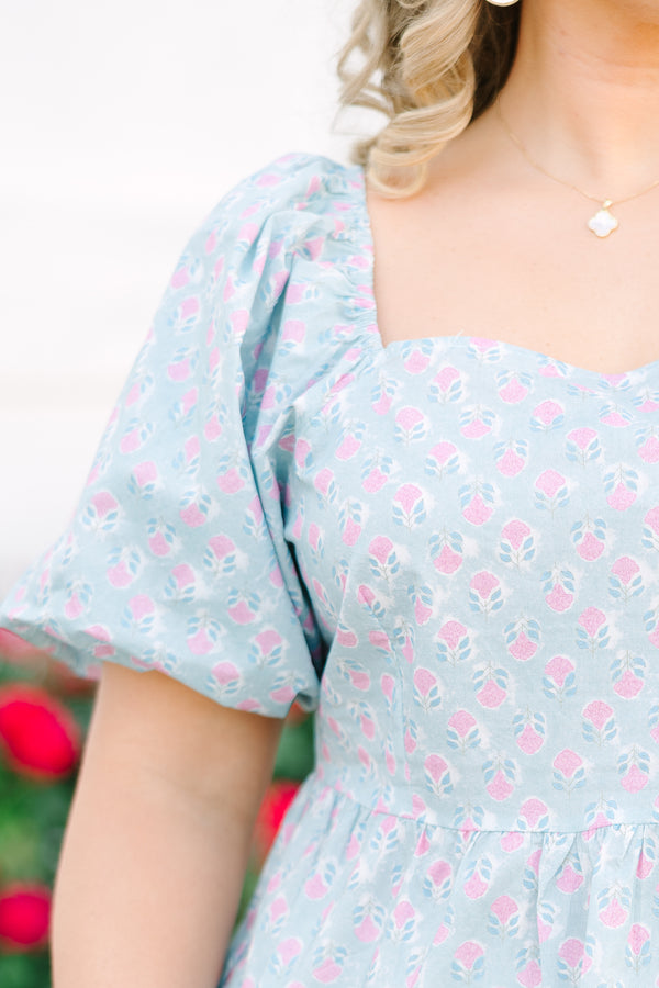 Chic Soul plus size clothing, a peplum style top in a primarily blue with pink floral print and puff sleeves