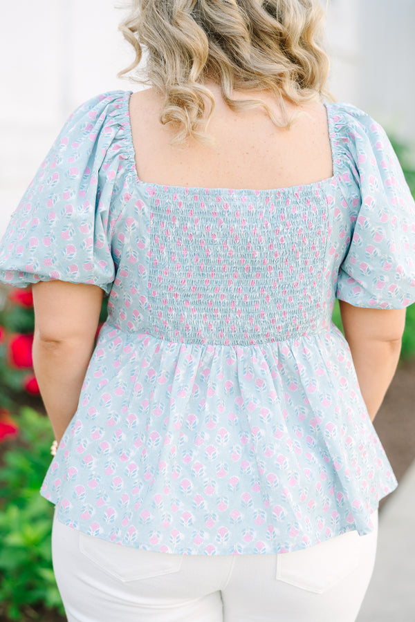 Chic Soul plus size clothing, a peplum style top in a primarily blue with pink floral print and puff sleeves