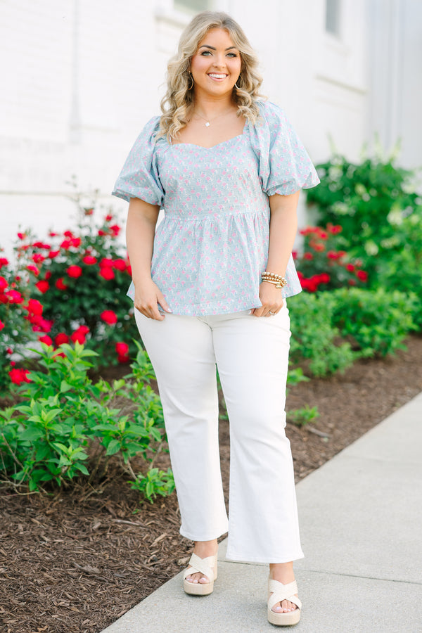 Chic Soul plus size clothing, a peplum style top in a primarily blue with pink floral print and puff sleeves