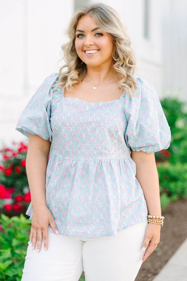 Chic Soul plus size clothing, a peplum style top in a primarily blue with pink floral print and puff sleeves