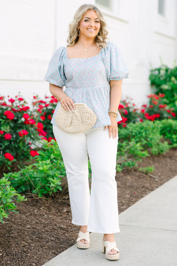 Chic Soul plus size clothing, a peplum style top in a primarily blue with pink floral print and puff sleeves
