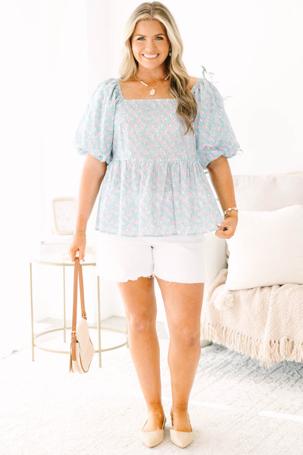 Chic Soul plus size clothing, a peplum style top in a primarily blue with pink floral print and puff sleeves