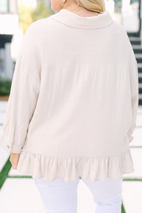 Chic Soul plus size clothing, tan long sleeve top with collar and buttons down the front and a ruffle babydoll style hem at the bottom of the top