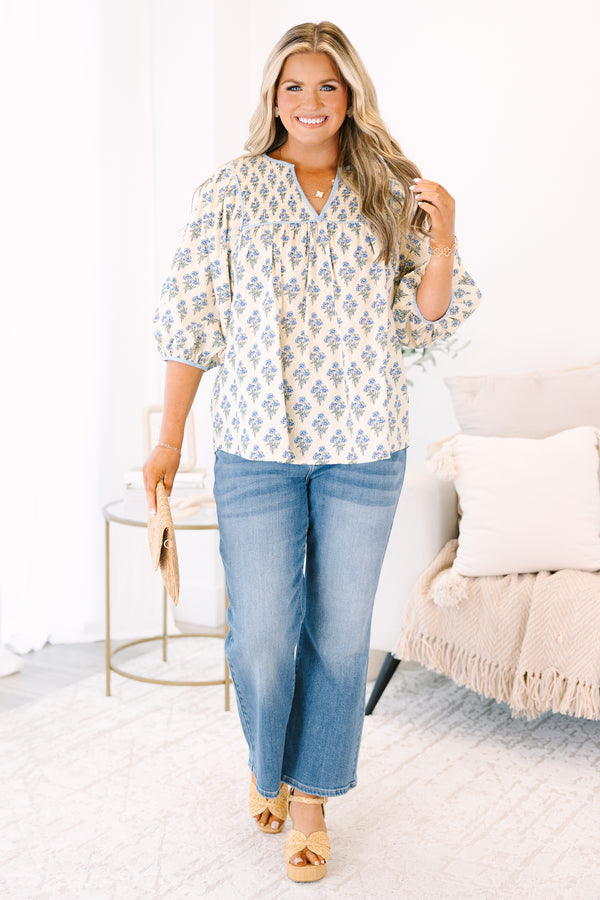 Plus Size cream floral cotton top with blue piping, smocked chest, and three-quarter sleeves.