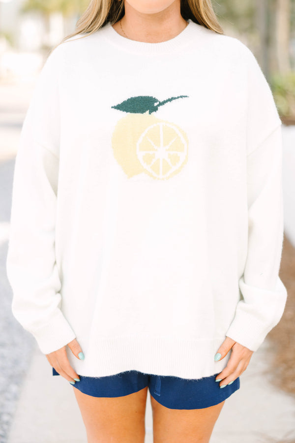 Chic Soul plus size clothing, ivory long sleeve knit sweater with light yellow lemon cut in half with one side showing the inside of the lemon and the other showing the outside with a green leaf and stem