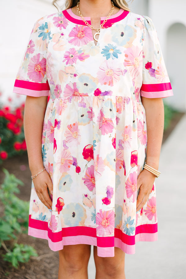 Chic Soul plus size clothing,  white knee length dress with a floral pattern throughout the dress as well as pink and red thick stripes at the bottom of the dress around the neckline and end of each sleeve