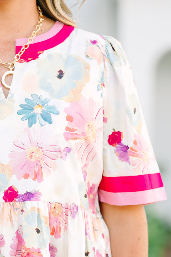 Chic Soul plus size clothing,  white knee length dress with a floral pattern throughout the dress as well as pink and red thick stripes at the bottom of the dress around the neckline and end of each sleeve