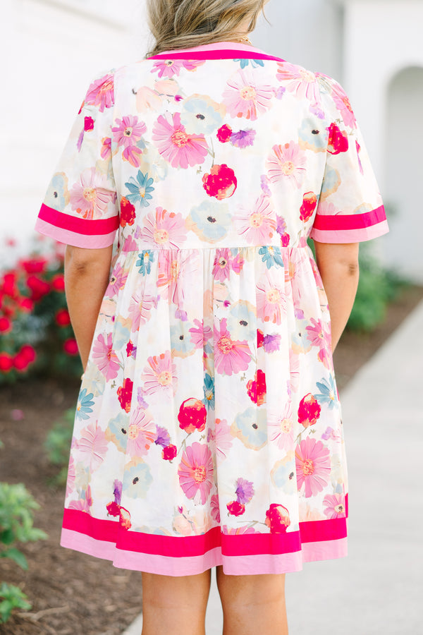 Chic Soul plus size clothing,  white knee length dress with a floral pattern throughout the dress as well as pink and red thick stripes at the bottom of the dress around the neckline and end of each sleeve