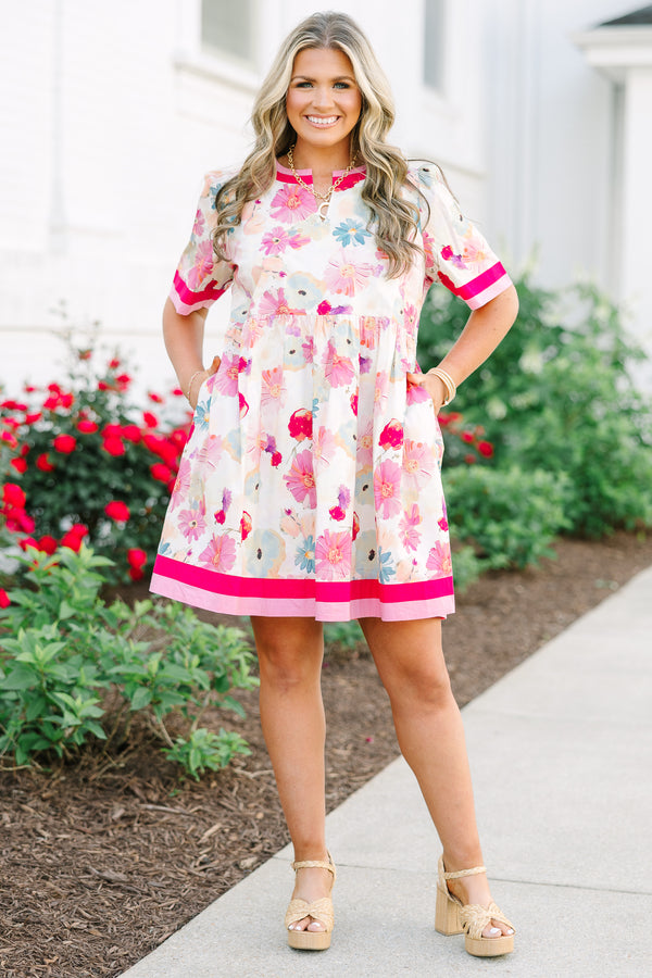 Chic Soul plus size clothing,  white knee length dress with a floral pattern throughout the dress as well as pink and red thick stripes at the bottom of the dress around the neckline and end of each sleeve