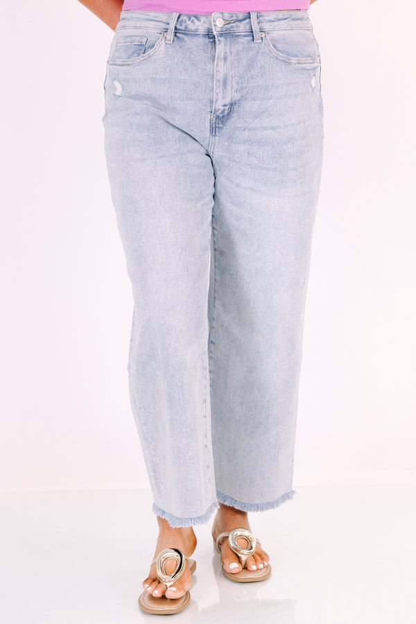 Chic Soul plus size clothing, light wash wide-leg jeans with a high waist and frayed hems.