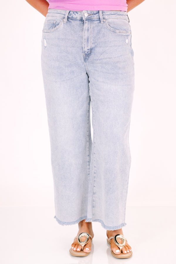 Chic Soul plus size clothing, light wash wide-leg jeans with a high waist and frayed hems.