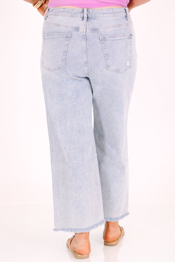 Chic Soul plus size clothing, light wash wide-leg jeans with a high waist and frayed hems.