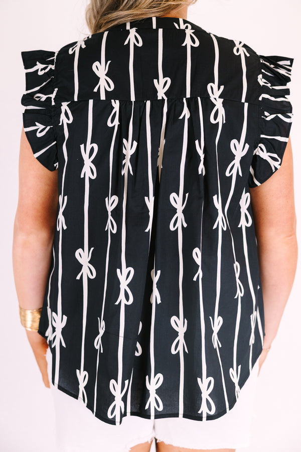 Chic soul plus size clothing, black top with flutter sleeves and a v-neckline as well as a white bow striped pattern throughout
