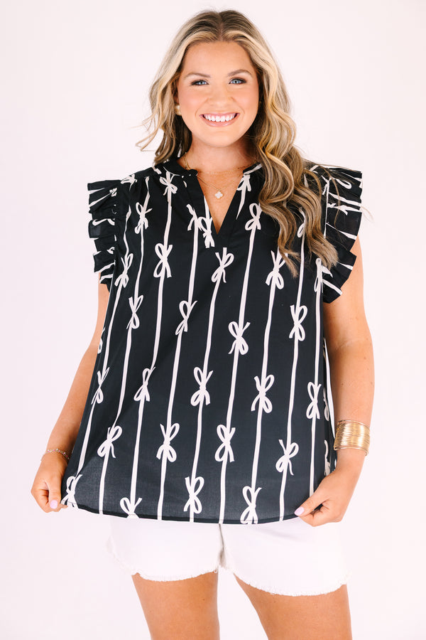 Chic soul plus size clothing, black top with flutter sleeves and a v-neckline as well as a white bow striped pattern throughout
