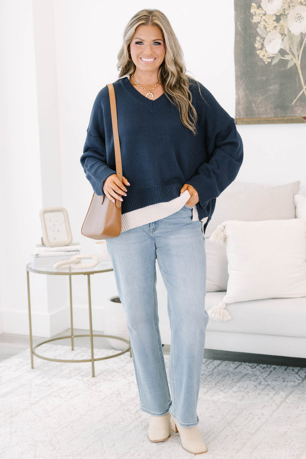 Plus size navy v-neck sweater with a relaxed, flowy fit and ribbed hem 