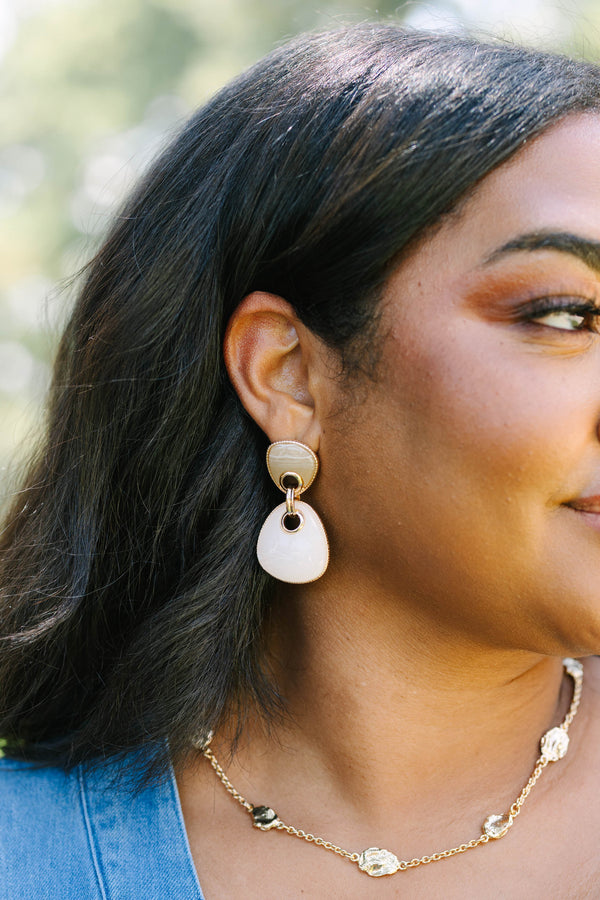 Plus Size gold drop earrings with two-tier neutral stone pendants and a gold chain necklace.