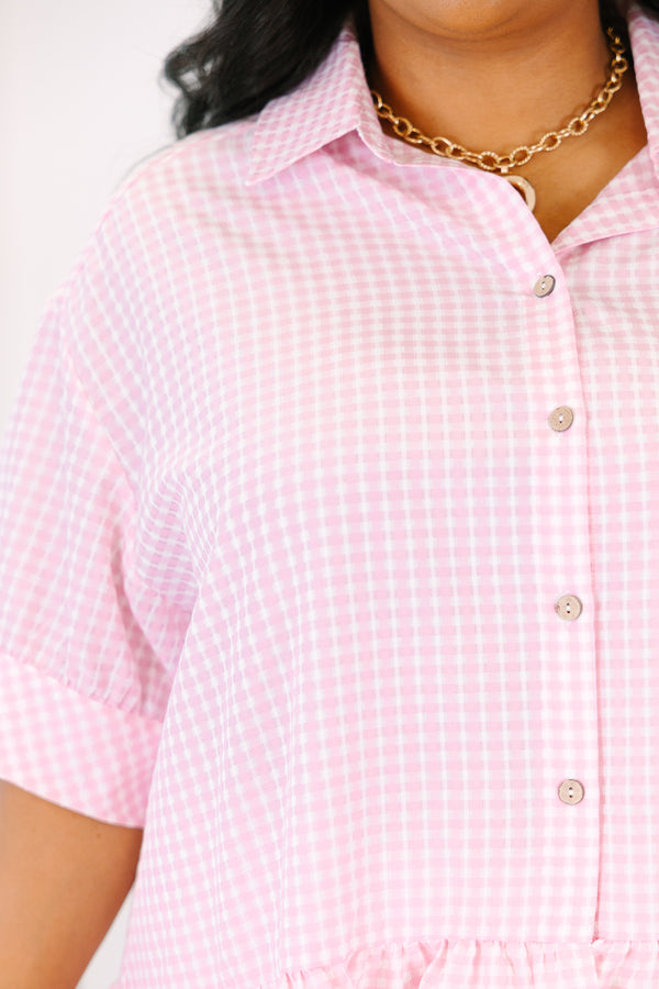 Plus Size pink gingham button-down top with short puff sleeves and a ruffled hem.