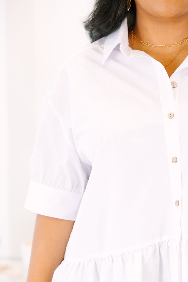 Plus Size white button-down top with short puff sleeves and a ruffled hemline.