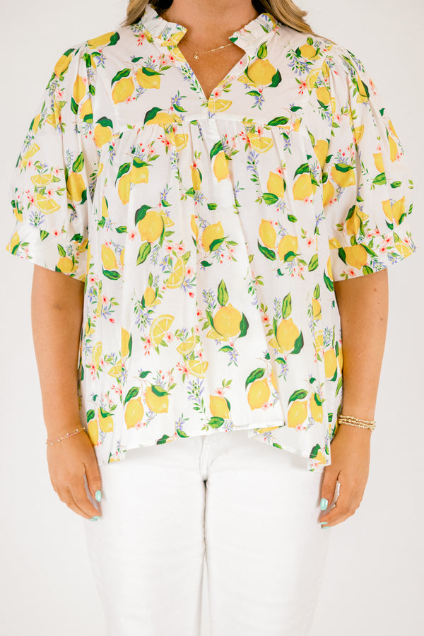 Chic Soul plus size clothing, white short sleeve top with yellow lemon print design through the top, v-neckline, and slight ruffle collar