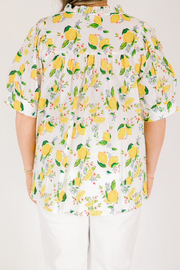 Chic Soul plus size clothing, white short sleeve top with yellow lemon print design through the top, v-neckline, and slight ruffle collar