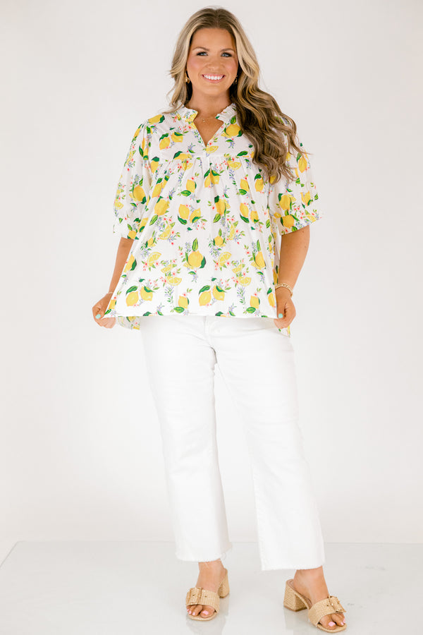 Chic Soul plus size clothing, white short sleeve top with yellow lemon print design through the top, v-neckline, and slight ruffle collar