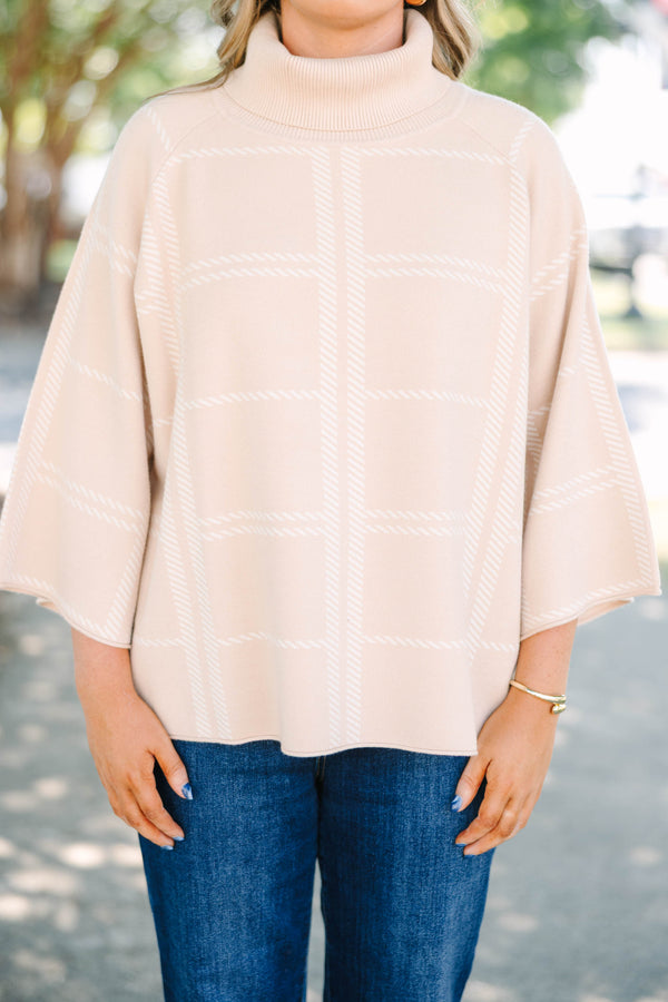 Plus Size taupe turtleneck sweater with a white windowpane plaid pattern and wide bell sleeves.