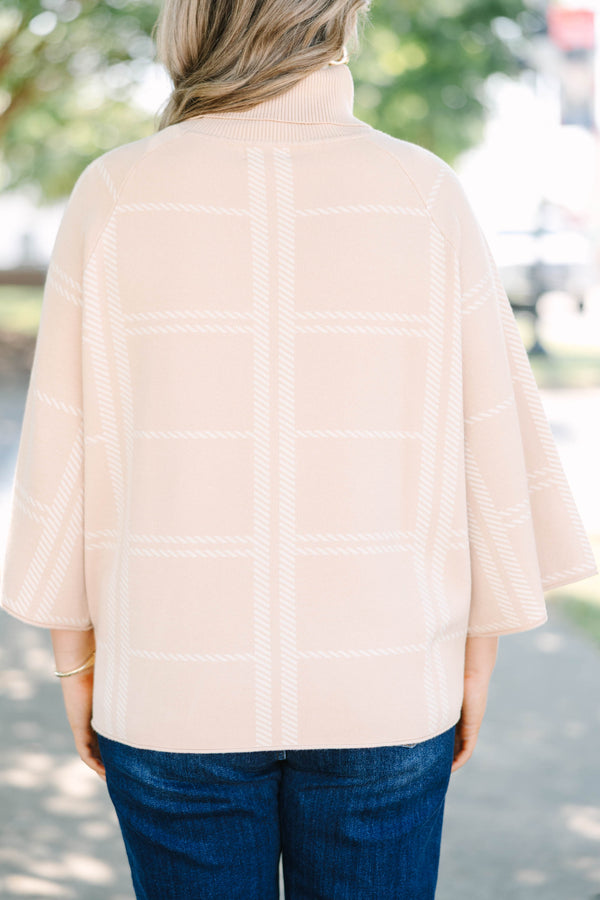 Plus Size taupe turtleneck sweater with a white windowpane plaid pattern and wide bell sleeves.