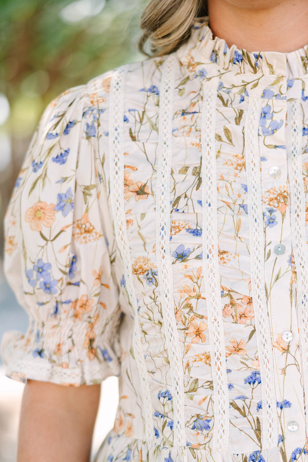 Plus Size cream floral top with puff sleeves, lace trim, and a high ruffled neckline.