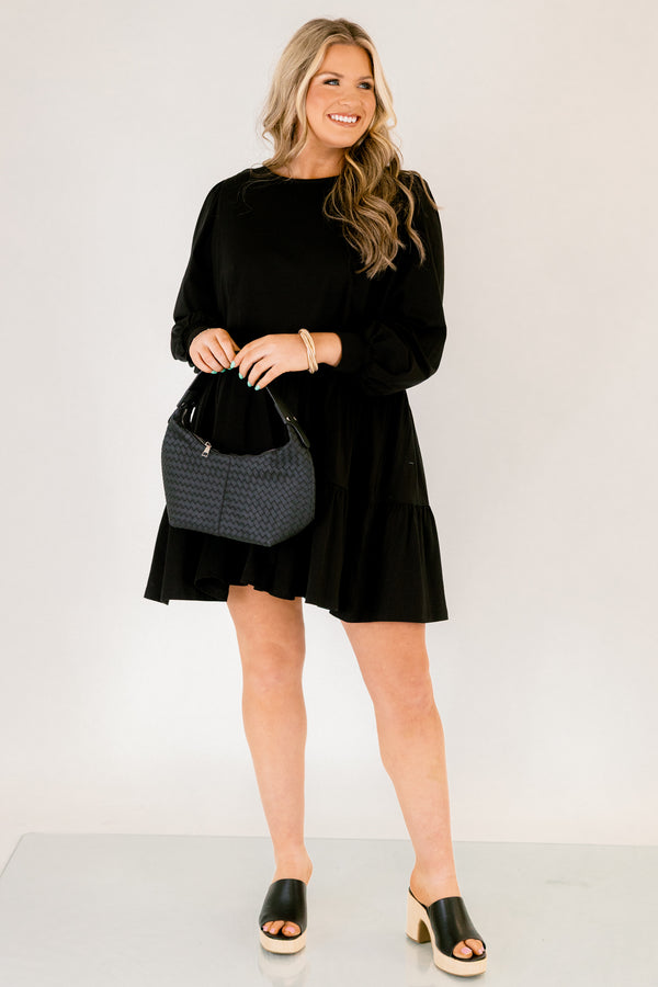 Chic Soul plus size clothing, solid black knee length dress with a high neckline and long sleeves that have cuffs at the end of each sleeve 