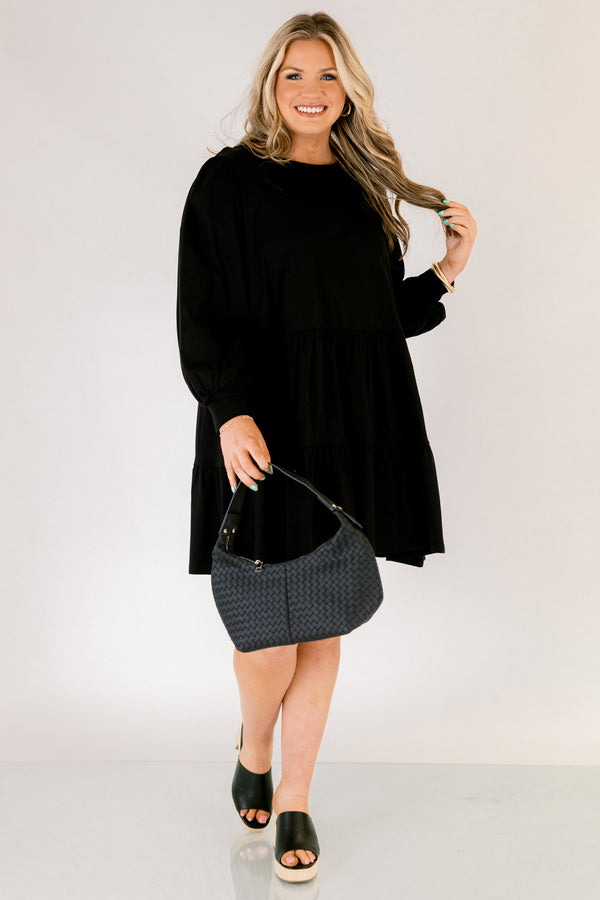 Chic Soul plus size clothing, solid black knee length dress with a high neckline and long sleeves that have cuffs at the end of each sleeve 