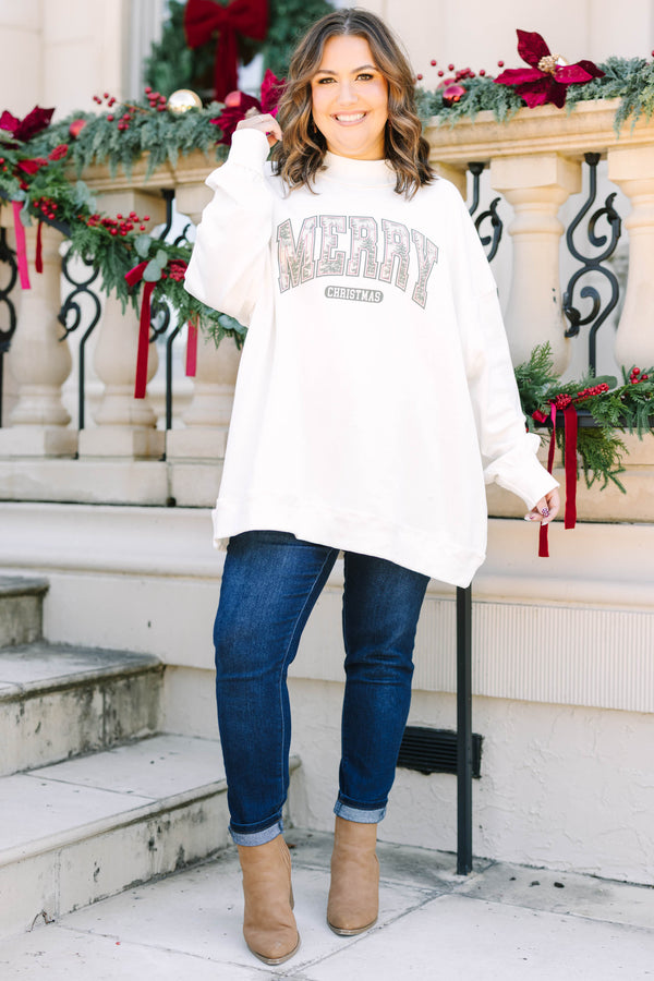 Plus Size ivory mock neck pullover with a graphic 