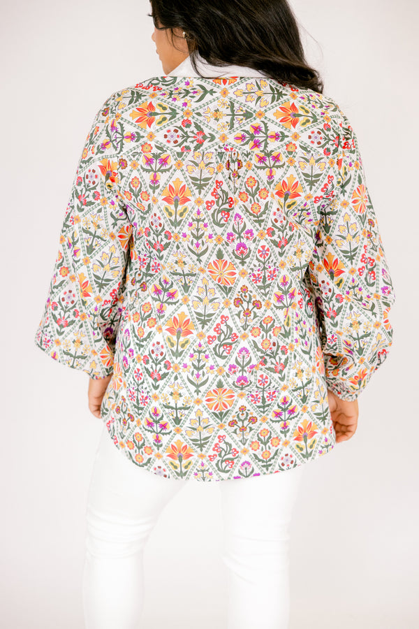 Chic Soul plus size clothing, multi colored floral pattern long sleeve button down top with cream trim along collar and buttons