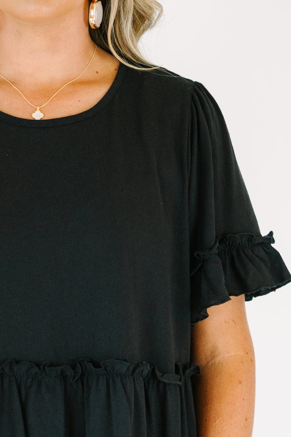 Plus Size black babydoll top with ruffled short sleeves and a tiered, ruffled hemline.