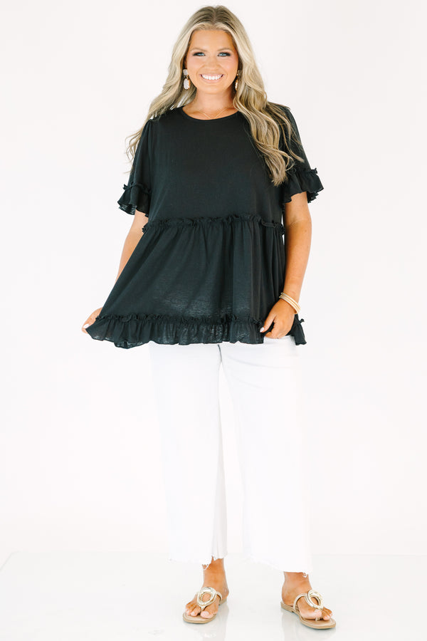 Plus Size black babydoll top with ruffled short sleeves and a tiered, ruffled hemline.