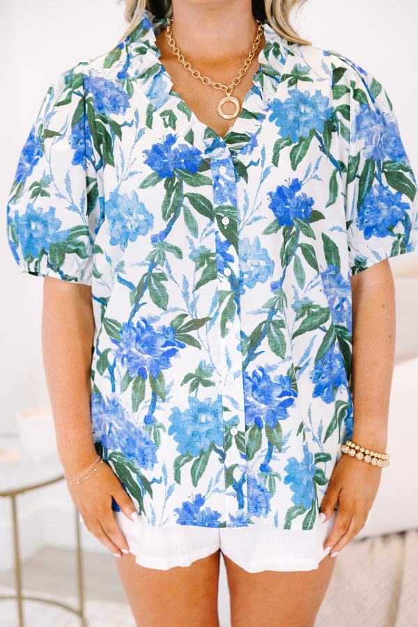 Plus Size ivory button-up top with blue floral print, ruffled collar, and puff sleeves.