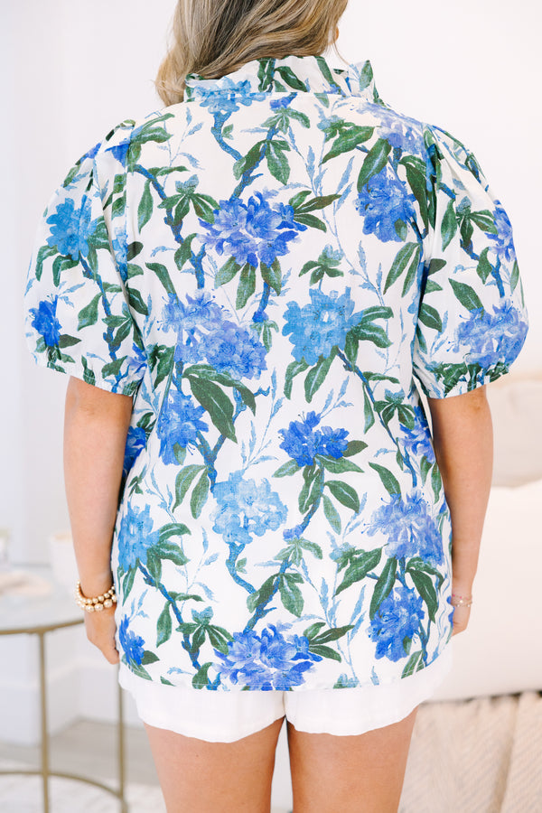 Plus Size ivory button-up top with blue floral print, ruffled collar, and puff sleeves.