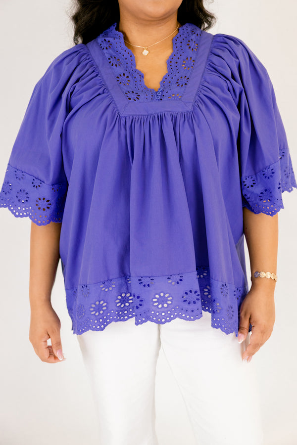 Chic Soul plus size clothing, blue flowy short sleeve top with eyelet detailing on the edges of the sleeves, bottom of top, and bordering v-neckline