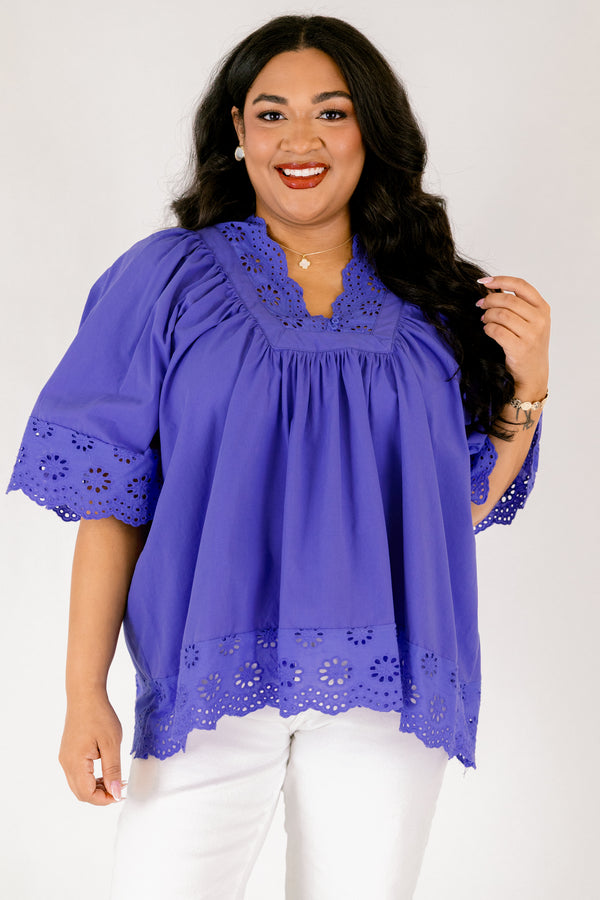 Chic Soul plus size clothing, blue flowy short sleeve top with eyelet detailing on the edges of the sleeves, bottom of top, and bordering v-neckline