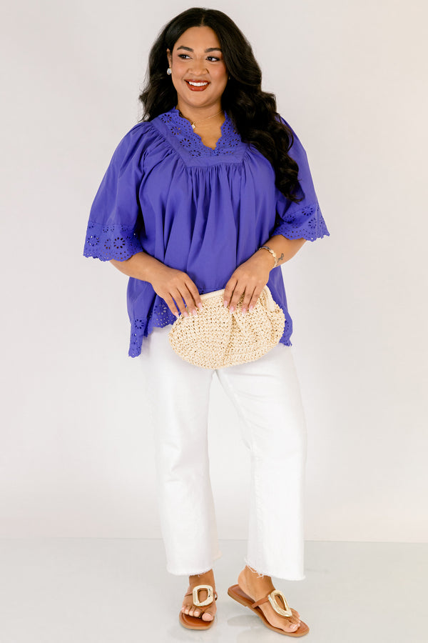 Chic Soul plus size clothing, blue flowy short sleeve top with eyelet detailing on the edges of the sleeves, bottom of top, and bordering v-neckline