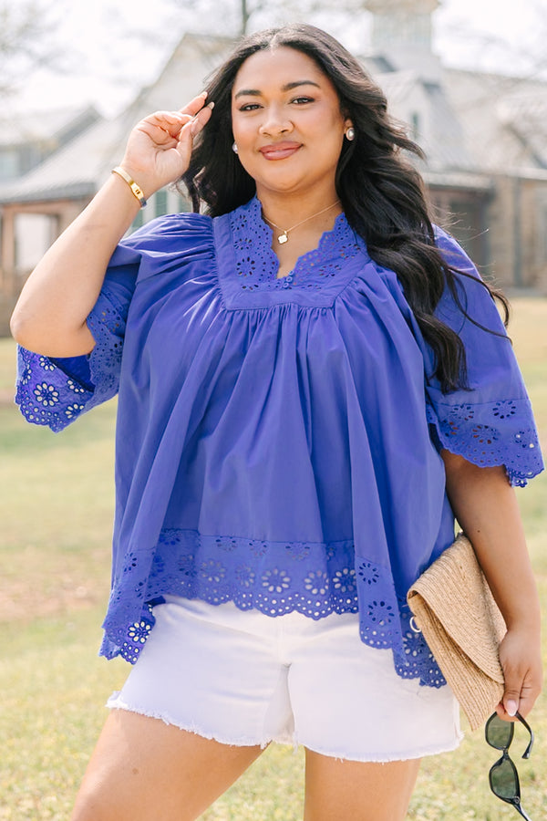 Chic Soul plus size clothing, blue flowy short sleeve top with eyelet detailing on the edges of the sleeves, bottom of top, and bordering v-neckline