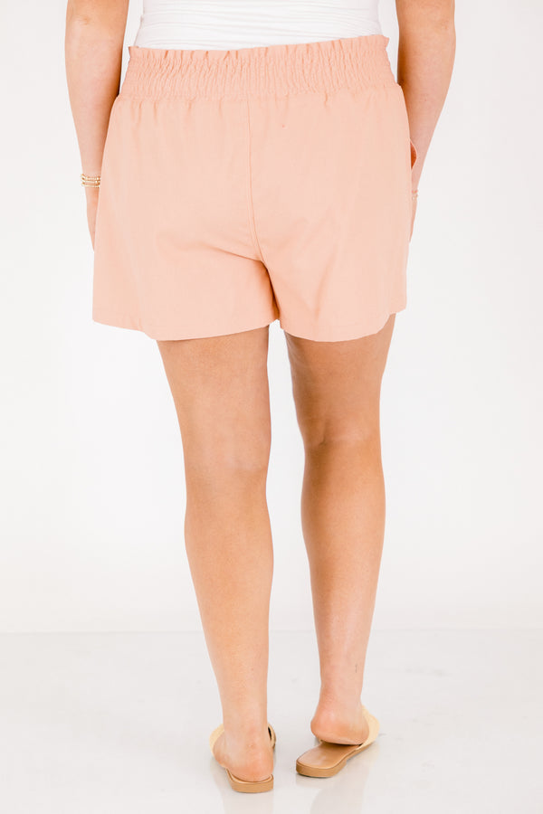 Chic Soul plus size clothing, peachy orange high waisted shorts with thick elastic waistband and a bow tying at the waist