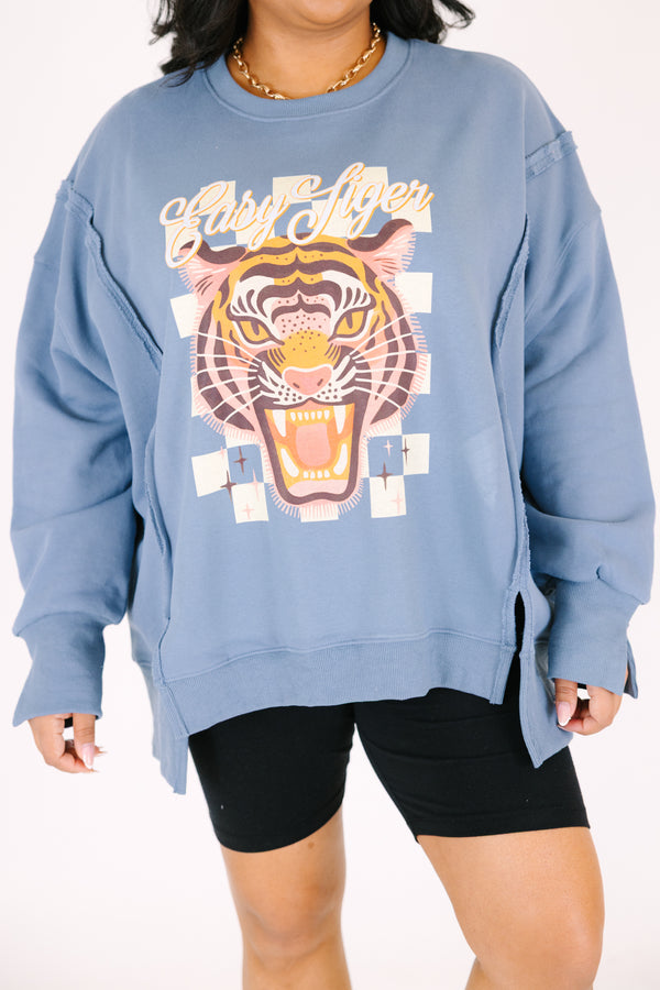 Chic Soul plus size clothing, denim colored long sleeve crew neck with a tiger graphic on the center of the crew neck that is on top of a checkered pattern as well the saying 