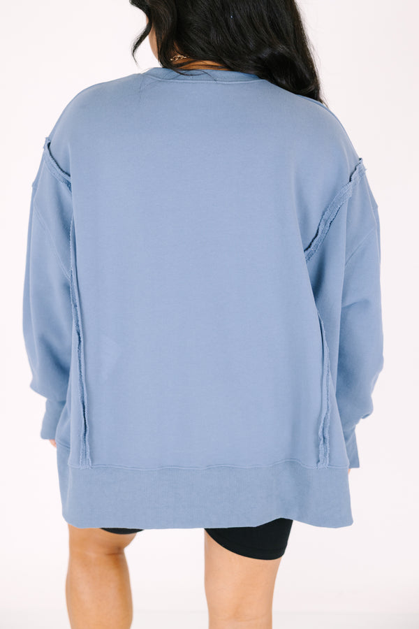 Chic Soul plus size clothing, denim colored long sleeve crew neck with a tiger graphic on the center of the crew neck that is on top of a checkered pattern as well the saying 