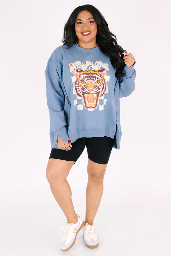 Chic Soul plus size clothing, denim colored long sleeve crew neck with a tiger graphic on the center of the crew neck that is on top of a checkered pattern as well the saying 