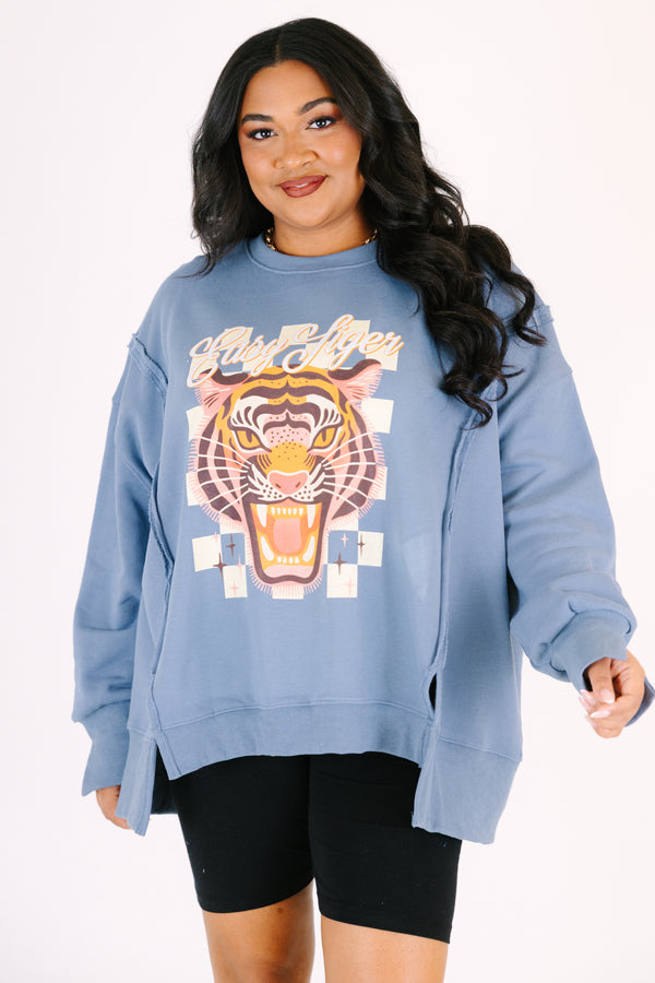 Chic Soul plus size clothing, denim colored long sleeve crew neck with a tiger graphic on the center of the crew neck that is on top of a checkered pattern as well the saying 