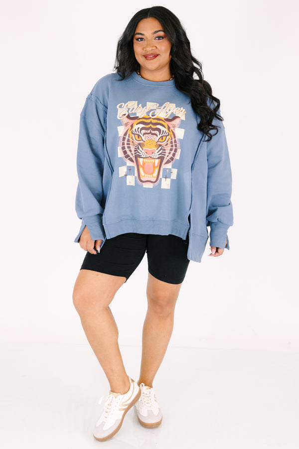 Chic Soul plus size clothing, denim colored long sleeve crew neck with a tiger graphic on the center of the crew neck that is on top of a checkered pattern as well the saying 