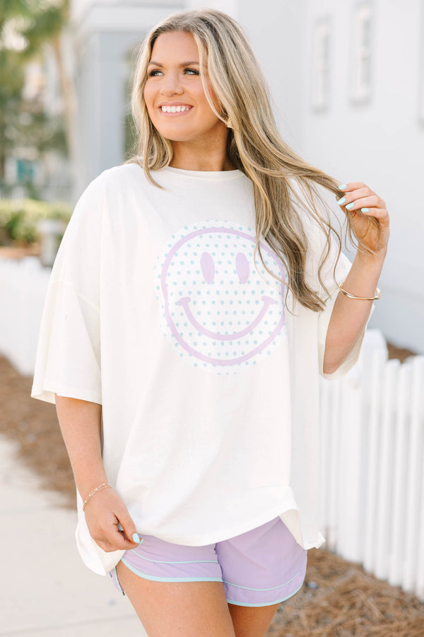 Chic Soul plus size clothing, white short sleeve boyfriend tee with light purple smiley face on white circle background on the front of the tee with light blue polka dots inside of the smiley face
