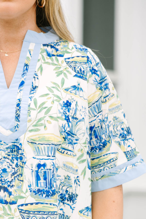 Chic Soul plus size clothing, blue knee length dress with a green and blue toile pattern and light blue outlining the bottom of the sleeves and also going along the v-neckline and bottom of the dress  