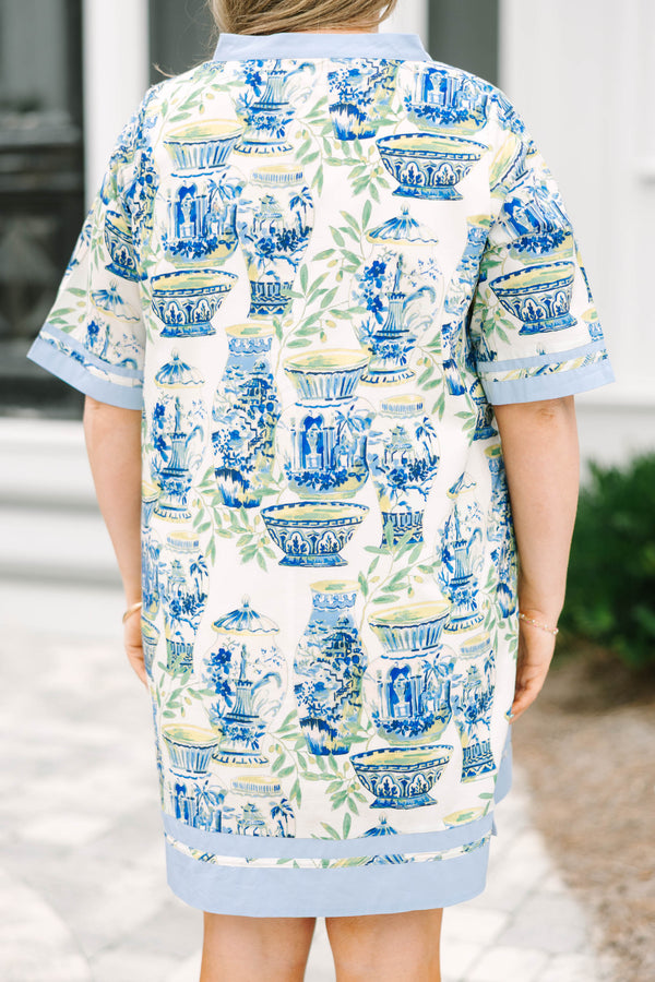 Chic Soul plus size clothing, blue knee length dress with a green and blue toile pattern and light blue outlining the bottom of the sleeves and also going along the v-neckline and bottom of the dress  