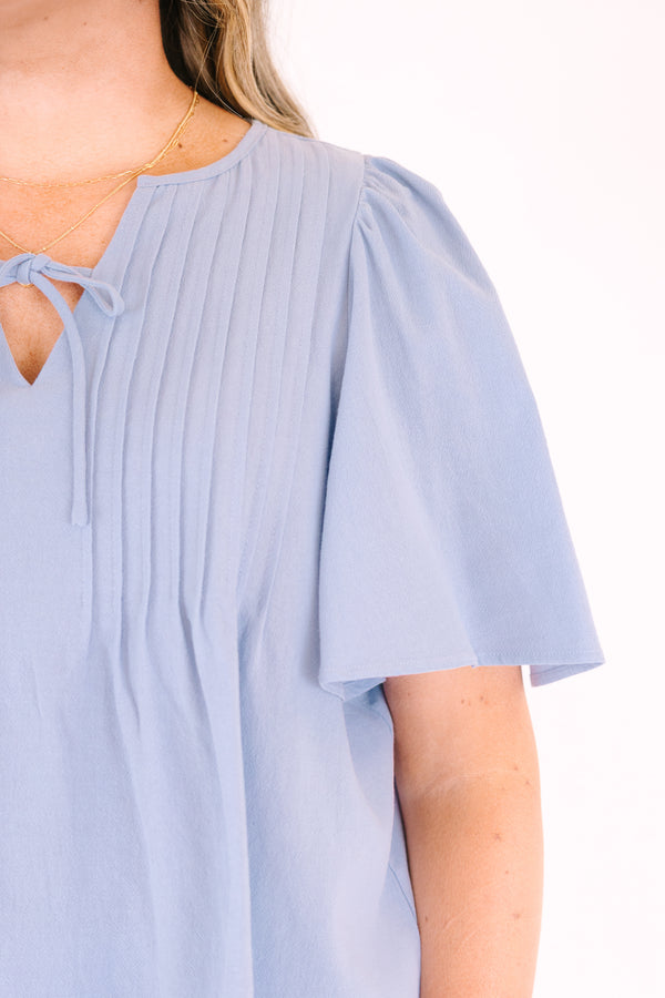 Chic Soul plus size clothing, light dusty blue short flutter sleeve top with v neck cutout and a drawstring bow tying across the cutout